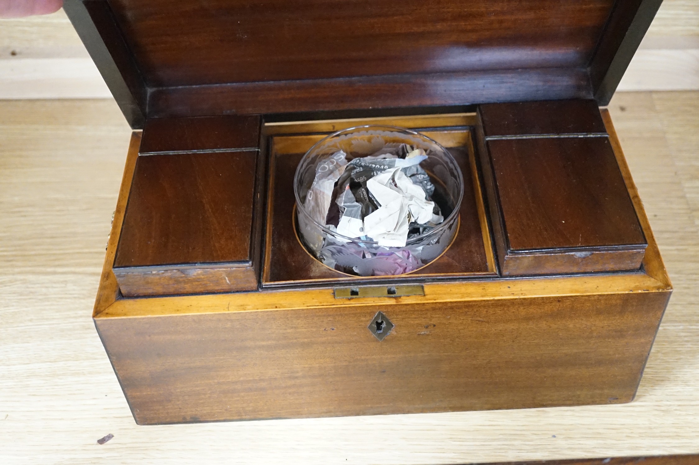 A George IV mahogany tea caddy and a Victorian rosewood and mother of pearl inlaid workbox-30cms wide x 14cms high